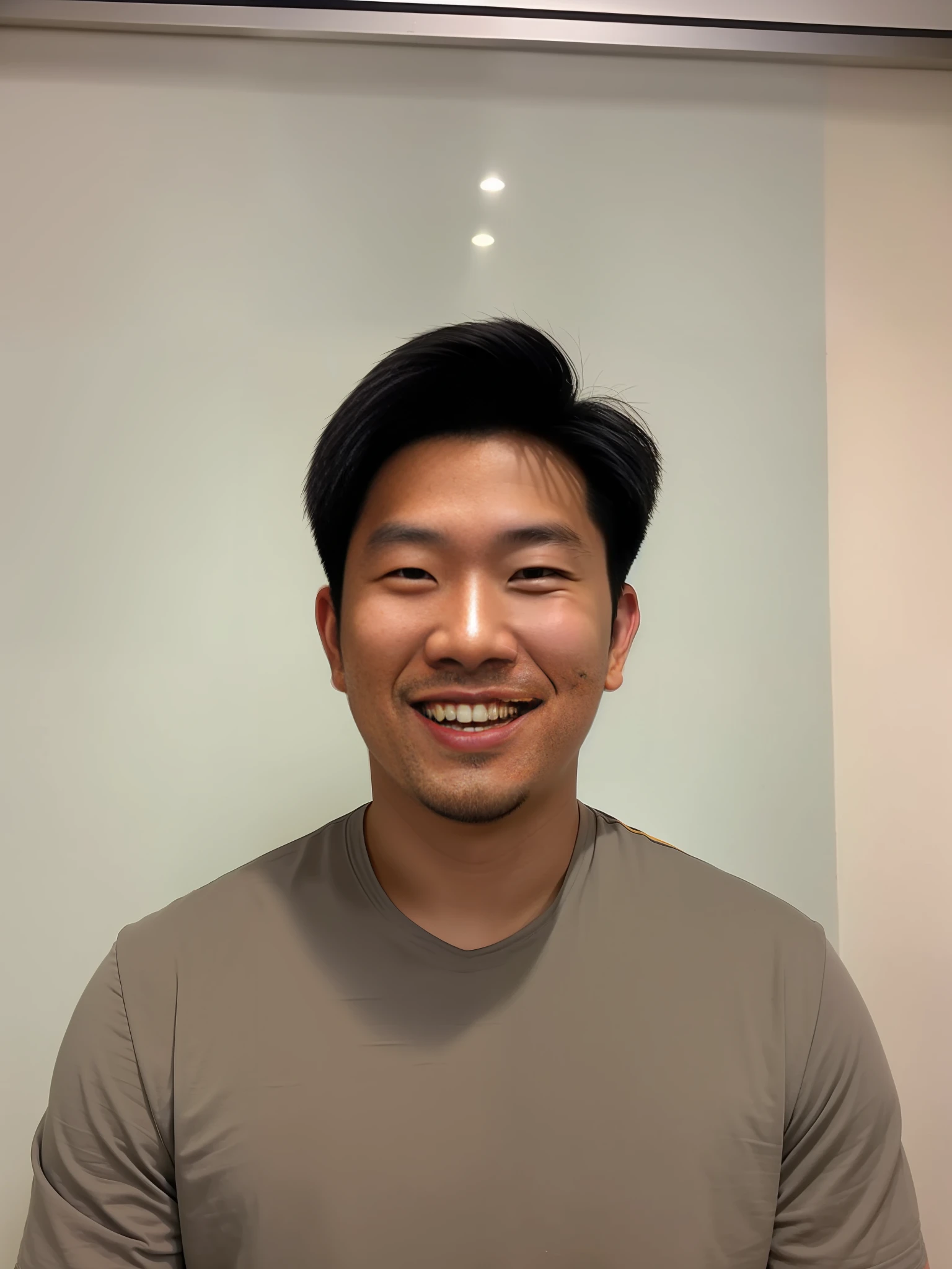 smiling man in a gray shirt holding a plate of food, kevin hou, andrew thomas huang, reuben wu, david luong, darren quach, victor ngai, christopher cao, headshot profile picture, damien tran, 2 , stanley artgem lau, south east asian with round face, jeremy cheung, ross tan, professional profile picture, rick dai