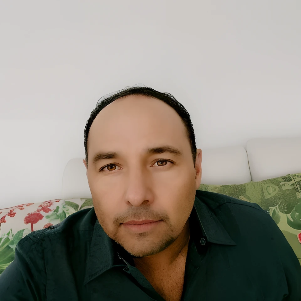 there is a man sitting on a couch with a remote control, (38 anos), Homem de 4 0 anos, cerca de 3 5 anos, andres rios, Jose Miguel Romano Francisca, 38 anos, zigor samaniego, Eloy Morales, victor maristane, Homens de 45 anos, 3 2 anos, Carlos Ortega Elizalde