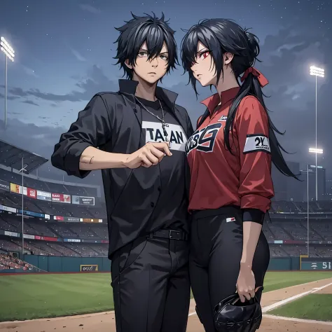A man in a black baseball outfit together with a woman (eye red) in a baseball outfit on the baseball field at night
