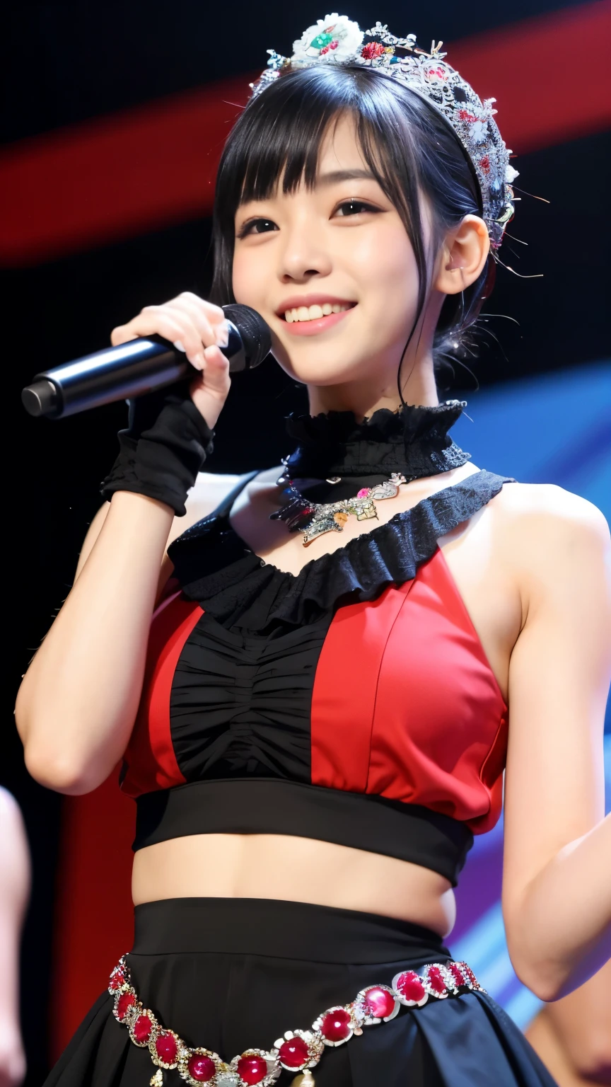 A close up of a woman in a red and black dress holding a microphone ...