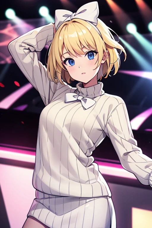 Blonde girl, in a long sleeve sweater, with a white bow on his head and short hair, dancing on stage 