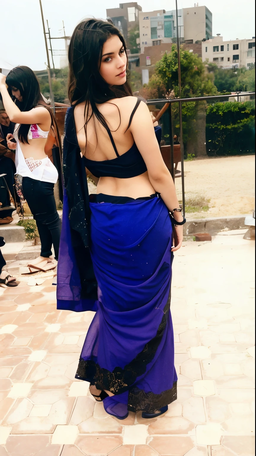 A woman in a blue sari and black top posing for a picture - SeaArt AI