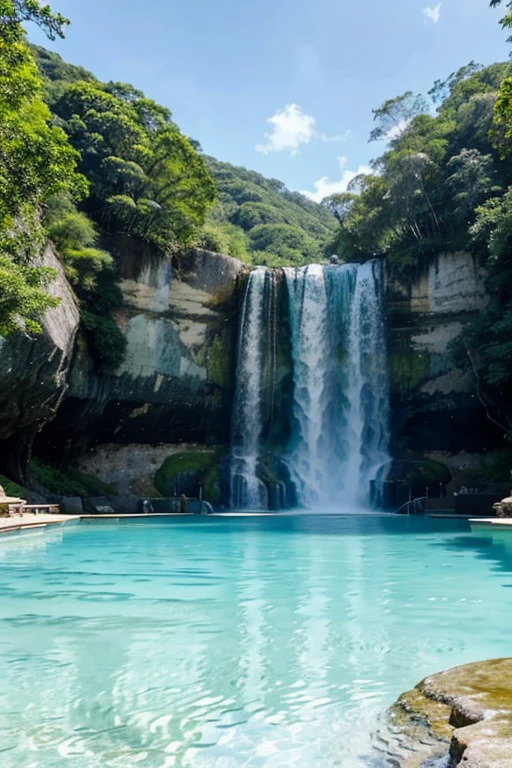 A majestic waterfall with turquoise water falling into a clear blue pool