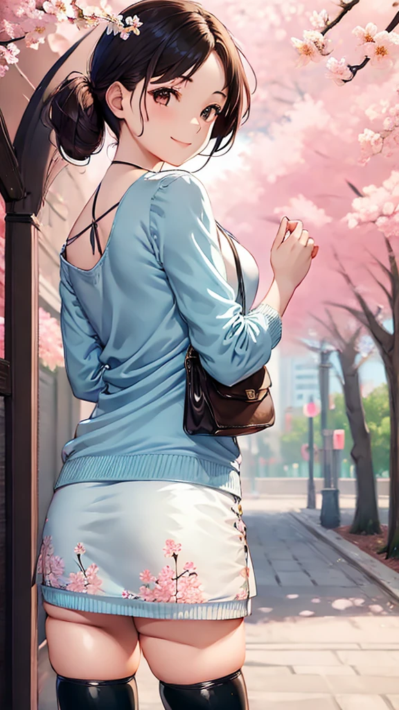 The girl is wearing a light blue cardigan over a floral frock. The frock is white with a blue floral pattern, and it appears to be knee-length. She has on black thigh-high socks and is carrying a small pink handbag. Her pose is bent forward, with one hand near her face and the other holding the handbag. She has long, dark brown hair and a gentle smile, standing in a setting with blooming cherry blossoms.