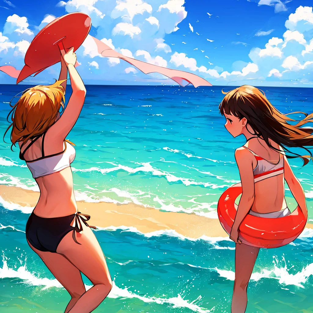 Girls playing at the beach in summer