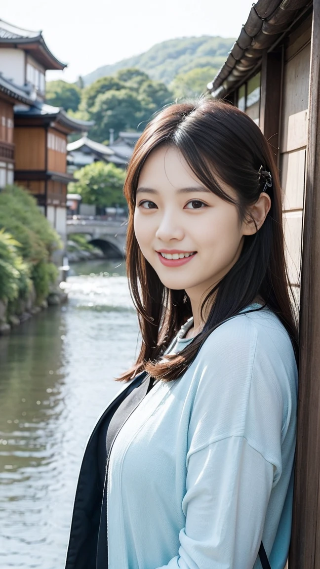 Smiling Asian woman with Kyoto river in the background