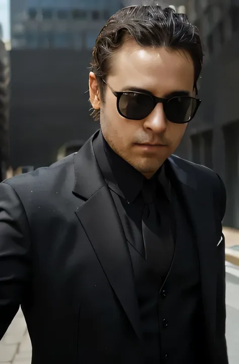 Sunglasses and black suit , looking straight ahead