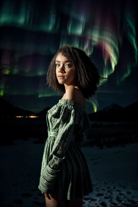 a woman standing in the snow with the aurora lights in the background