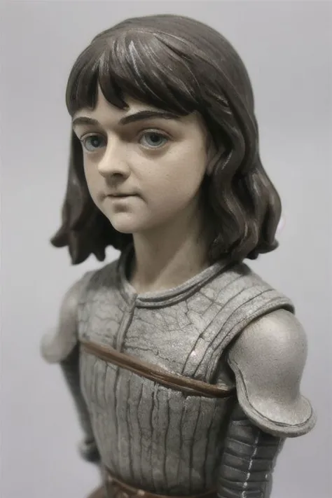 a close up of a toy figure of a woman with a sword