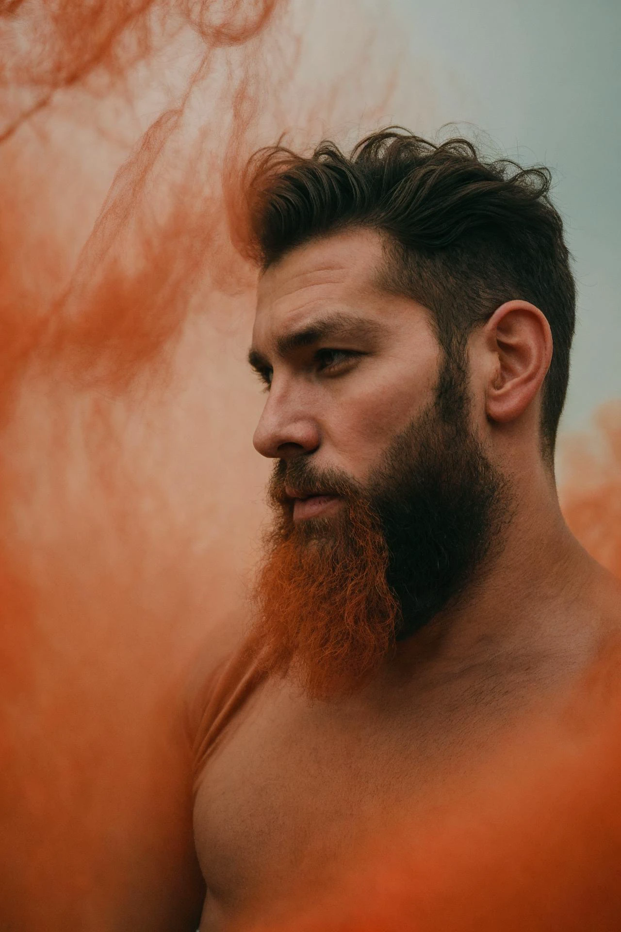 handsome bearded man, orange haze, artistic portrait