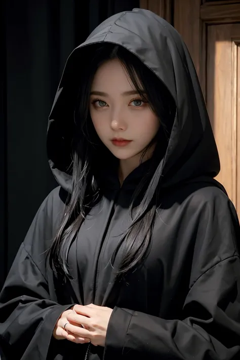 a close up of a woman wearing a black hoodedie