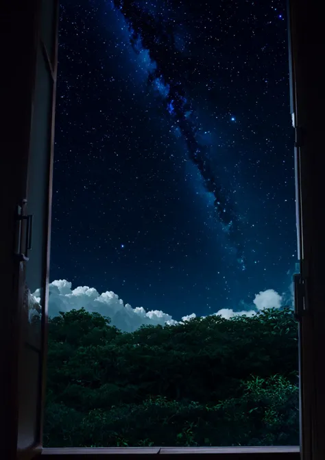 starry night sky seen through a window with a laptop