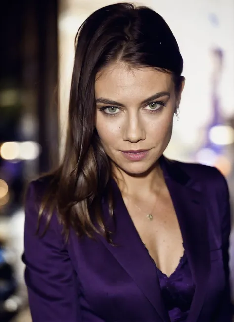 a close up of a woman in a purple suit and a necklace