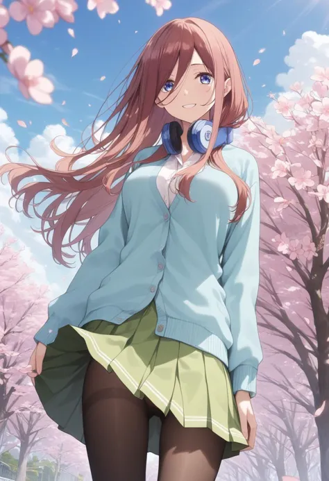 a girl in a blue shirt and green skirt standing in front of a tree