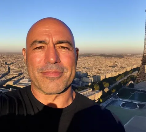 <lora:Joe Rogan - Trigger w Joerogan Person:1>joerogan person taking a selfie on top of the eiffel tower around sunset. Golden hour lighting.