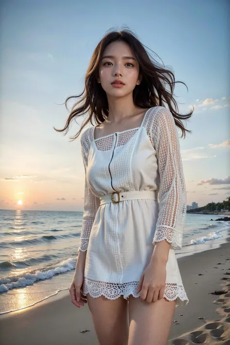 a woman standing on a beach next to the ocean at sunset