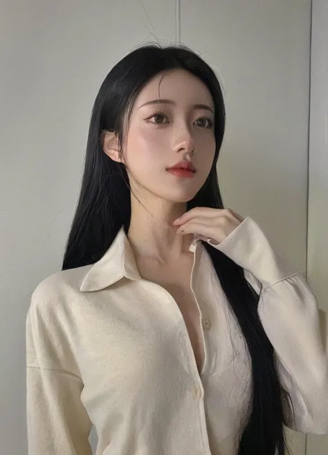 a close up of a woman with long black hair wearing a white shirt