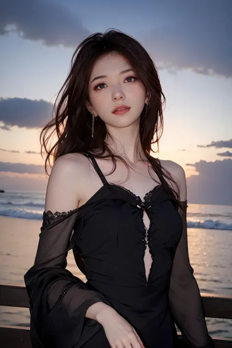 a woman in a black dress standing on a beach next to the ocean