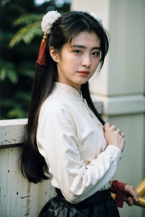 a close up of a woman with a white shirt and a red bow