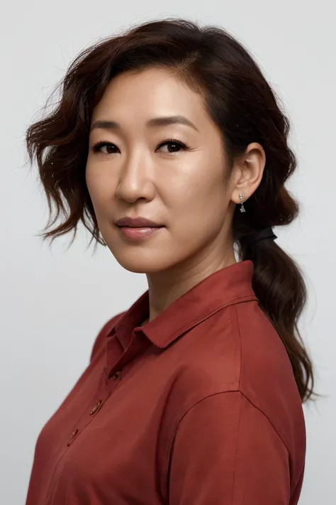 a close up of a woman with a red shirt and a ponytail