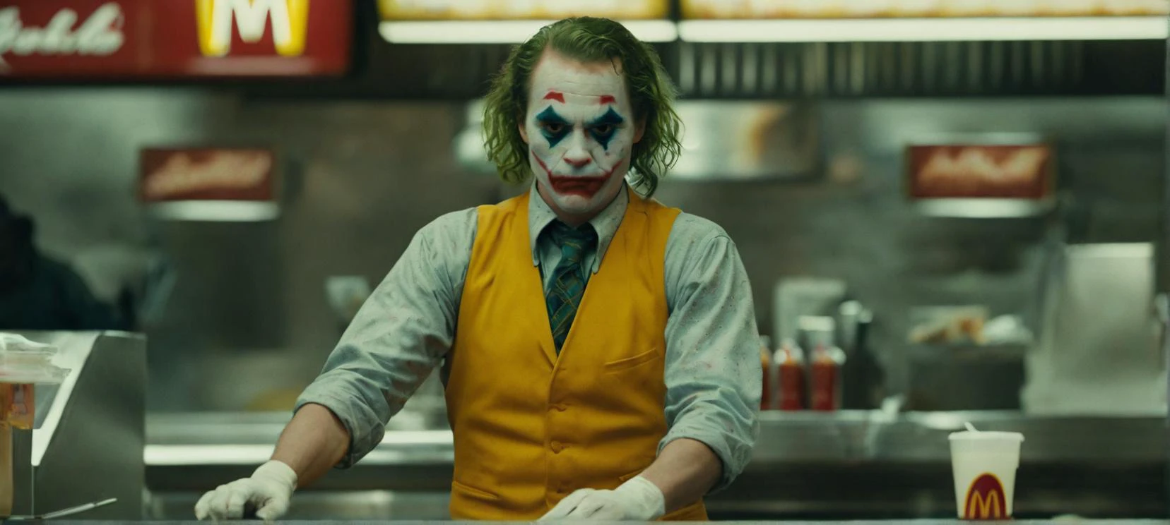 closeup film still cinestill of The joker working on mcdonalds,  epic, cinematic,