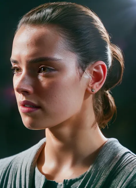 a woman with a ponytail in a grey shirt stares at something