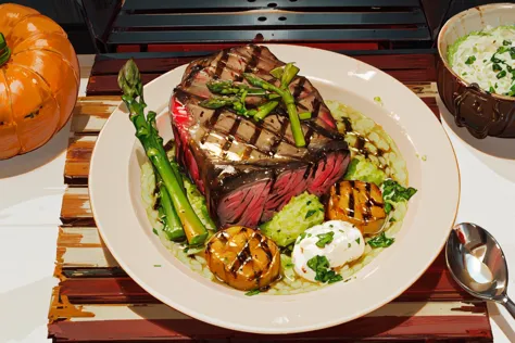 there is a plate of food on a place mat with a spoon