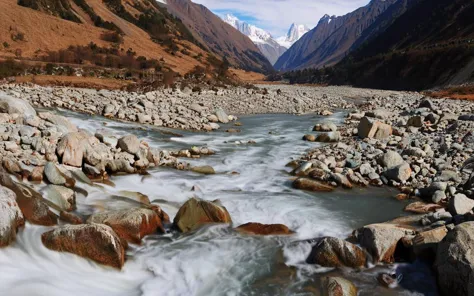 a river flowing through a rocky mountain valley