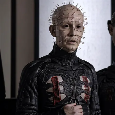 a close up of two men in leather jackets with pinhead heads