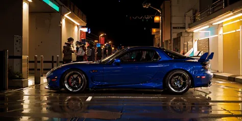 arafed blue sports car parked in a wet parking lot